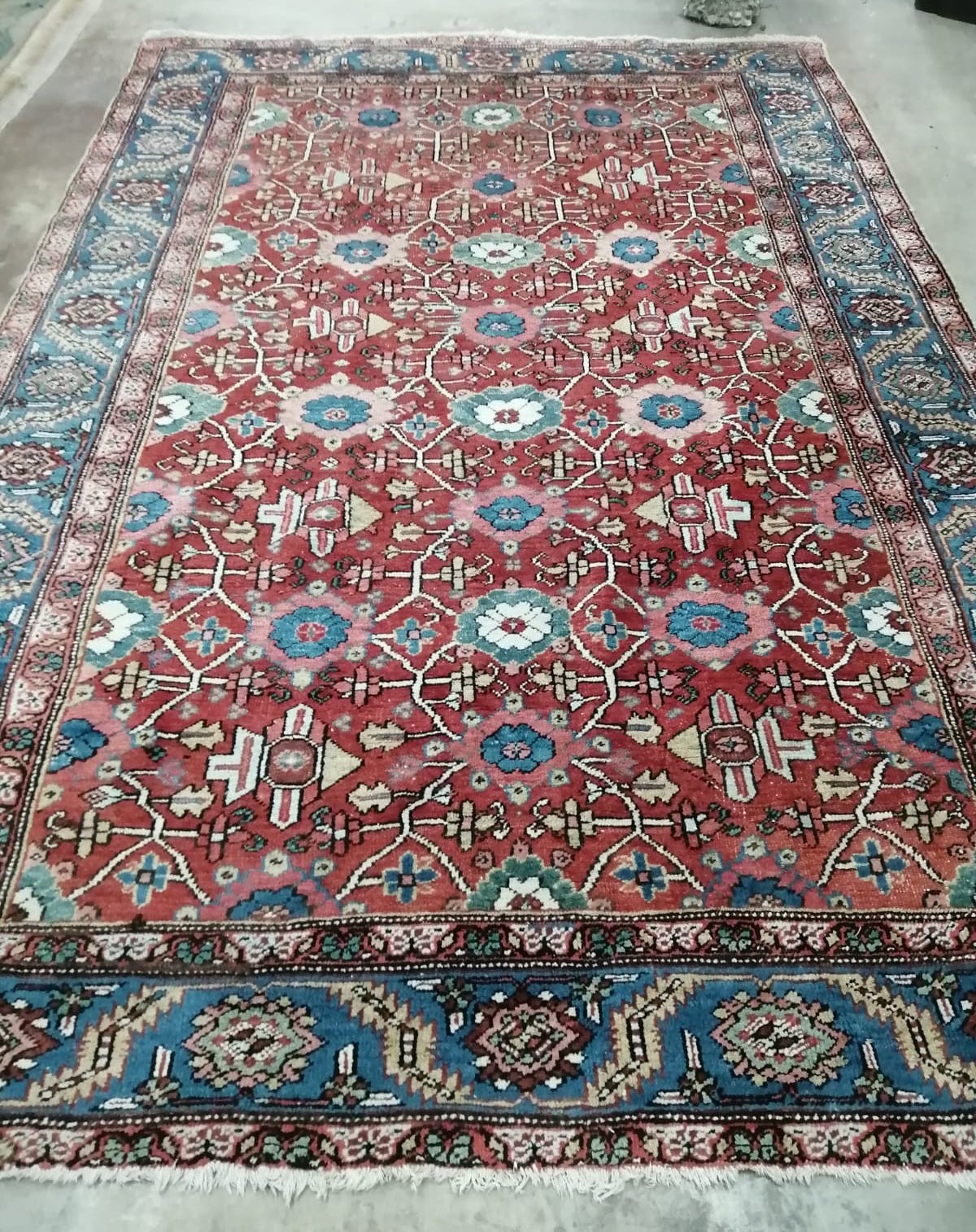 A Hamadan red ground carpet, 332 x 242cm